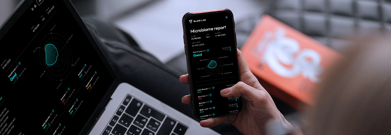 Hand holding mobile phone with an app on screen